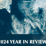 Satellite image of swirls of clouds over the ocean. Below the image, white text on a slightly transparent blue background reads "2024 Year in Review."